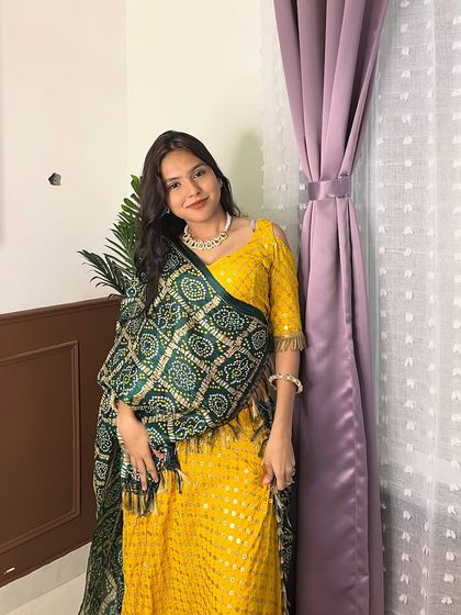 Why buy when you can rent and shine? This client is wearing a yellow chanya choli with a green bandhani dupatta from my Navratri collection.