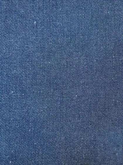The rich texture of a medium-blue rigid denim. This is the perfect starting point for a timeless pair of custom-fit jeans.