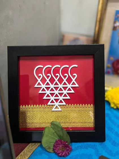 Another happy client's photo, where my Saraswati frame with a red 'Khan' border is part of their festive decor.
