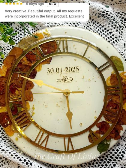 This custom wall clock features preserved flowers around the edge and includes a five-star review from the client. It shows my commitment to incorporating all client requests to create the perfect piece.