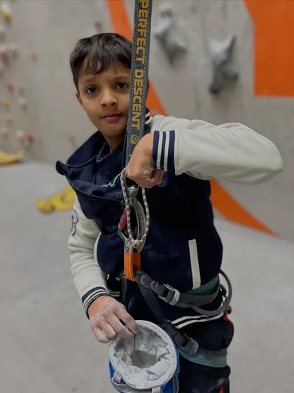 This young climber is getting ready for his ascent, chalk bag and all. We provide all the necessary rental gear to make sure everyone is prepared for a great climb.