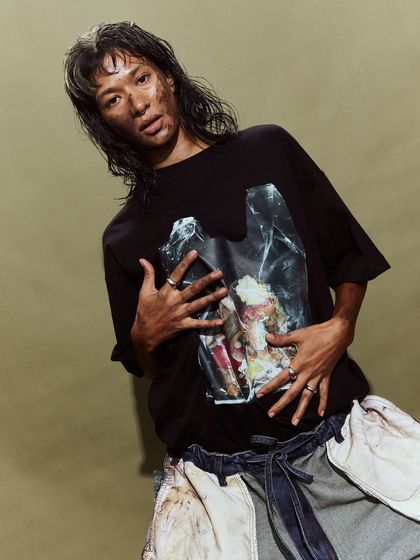 This look from the Huemn show featured a graphic tee and deconstructed pants, with dirt-effect makeup to enhance the raw, gritty aesthetic.