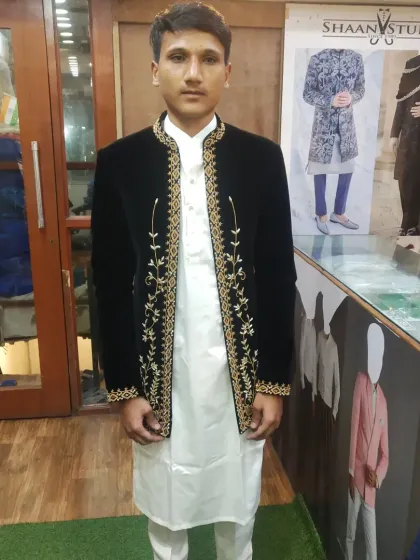The texture of velvet adds a touch of luxury to any outfit. This client is wearing a custom-fitted black velvet Jodhpuri jacket, elevated with delicate gold embroidery along the front opening for a regal and sophisticated finish.