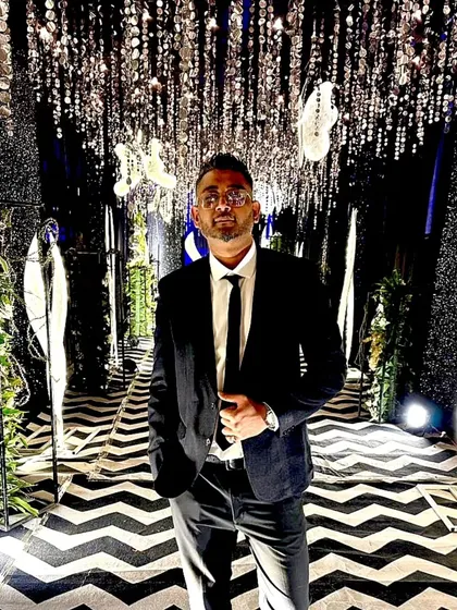 A full-length shot showing my formal attire. It's important to present a polished and professional image in all settings.