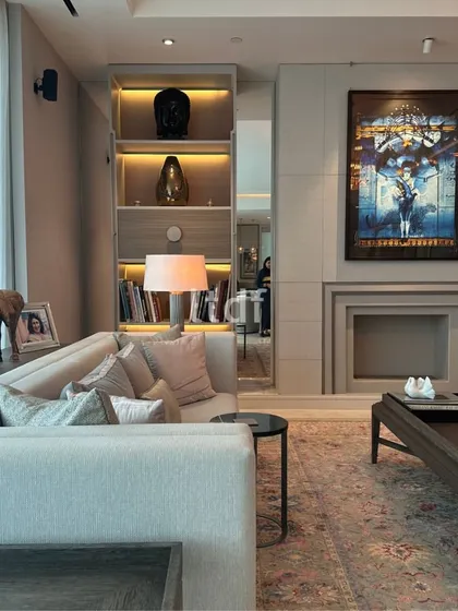 Nestled in the heart of Gurugram, this living room embodies a serene blend of muted greys and earthy brown furnishings. We introduced vibrant decor accents and artwork to add touches of personality, transforming the space into a plush haven of luxury and tranquility.