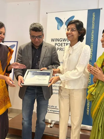 Deepak Ahuja, a regional prize winner, is honored at the award ceremony.