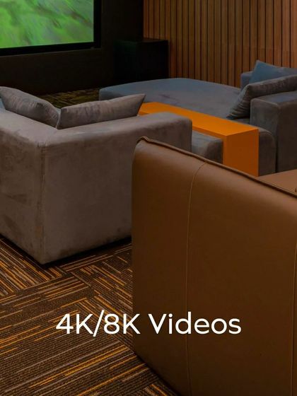 Every detail matters in a custom home theater. This series of shots highlights the clean lines of the ceiling lighting, the texture of the wood-paneled acoustic walls, and the high-quality finish of the leather recliner seats, all contributing to a premium experience.