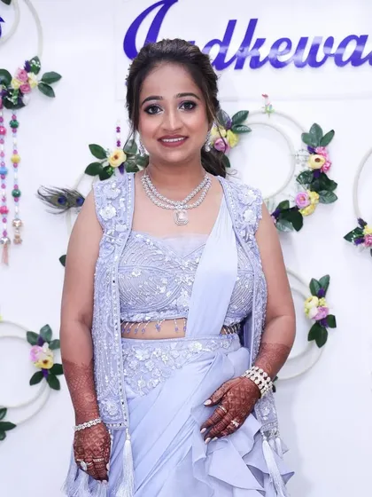 A full-length view of her beautiful outfit and complete look.