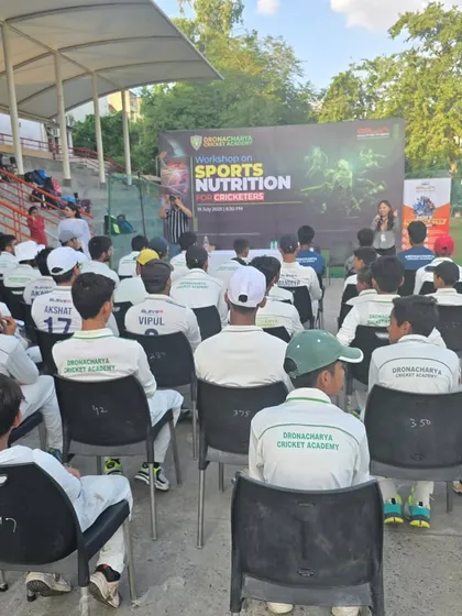 A wide shot of the sports nutrition workshop, with players and parents listening intently. We believe in educating our entire community to create a supportive ecosystem for our athletes' growth.