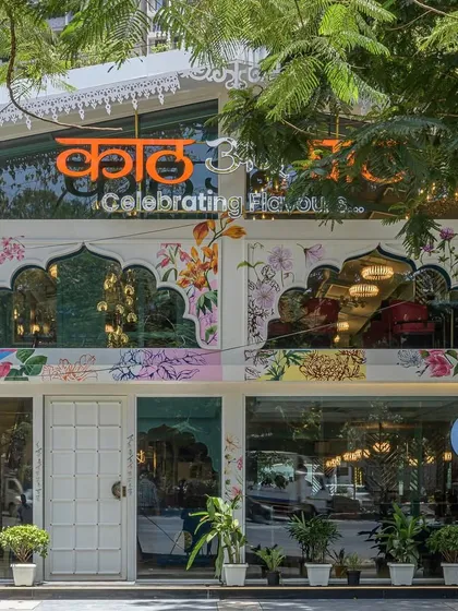 A restaurant's exterior becomes a public canvas, celebrating the rich foliage of Maharashtra. This hand-painted facade blends vibrant colors and intricate line work, turning the building itself into a landmark and a piece of storytelling art.