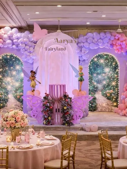 For a touch of magic, I design enchanting worlds like this "Fairyland" theme. The setup includes custom-built sparkling arches, whimsical fairy cutouts, and coordinated table settings to bring the entire fairytale to life.