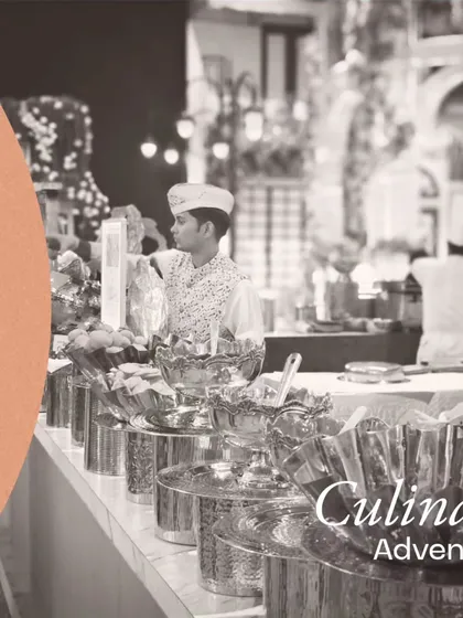 Elevate your dining experience with our culinary adventure. This chaat counter, with its gleaming silver bowls and organized setup, is a testament to our commitment to quality and presentation.