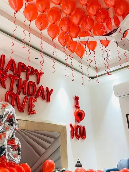 A close-up of the "Happy Birthday Love" and "I Love You" foil balloons, which are key elements in our romantic decoration packages.