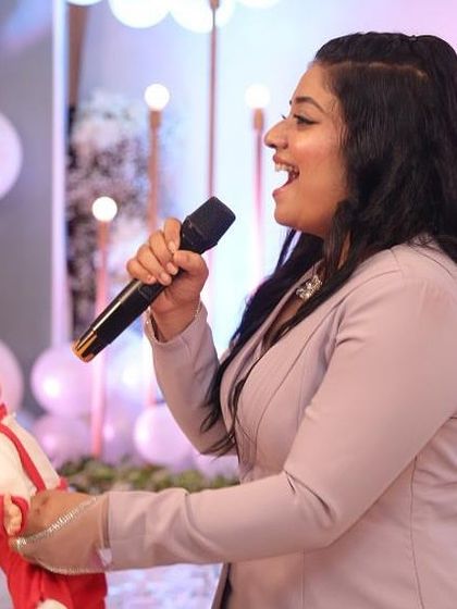 The host engaging the crowd with a baby doll during a game. I work with talented emcees who know how to make every activity entertaining.