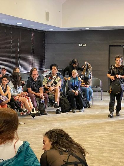 A student asking a question during a workshop. These interactions are my favorite part of teaching, as they lead to deeper understanding for the entire group.