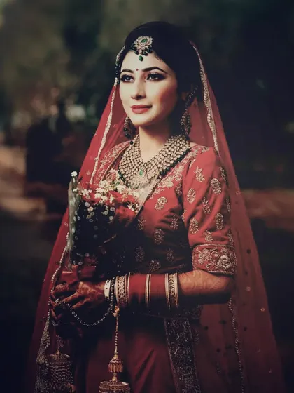 A classic bridal portrait with a soft, vintage feel, capturing the bride's serene expression and beautiful attire.