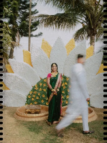An artistic shot from a Haldi ceremony, using a slow shutter speed to capture the groom in motion against the beautifully decorated backdrop.