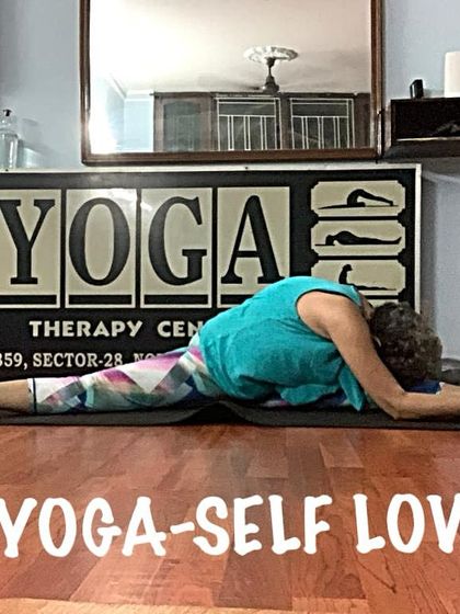 Another view of the deep forward bend in a split, showing the spinal articulation. I teach how to use breath to deepen your stretches safely.