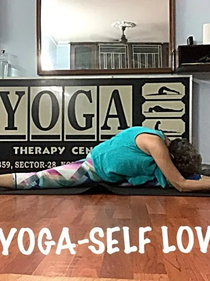 Another view of the deep forward bend in a split, showing the spinal articulation. I teach how to use breath to deepen your stretches safely.