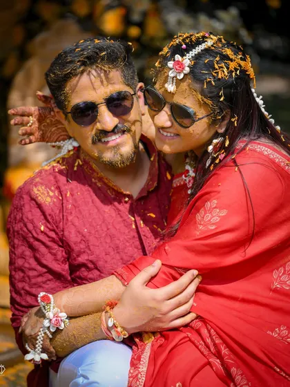 A happy couple portrait right after the Haldi rituals, covered in turmeric and love. Their smiles say it all.