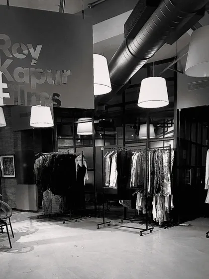 A black and white shot of the costume racks being prepped for a film. This is my office, where all the looks are organized and ready for the actors.