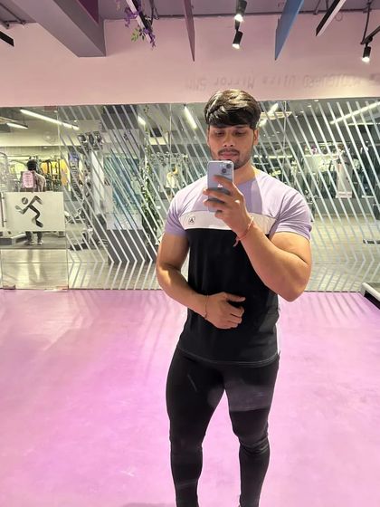 Another mirror selfie showing the physique from the front.