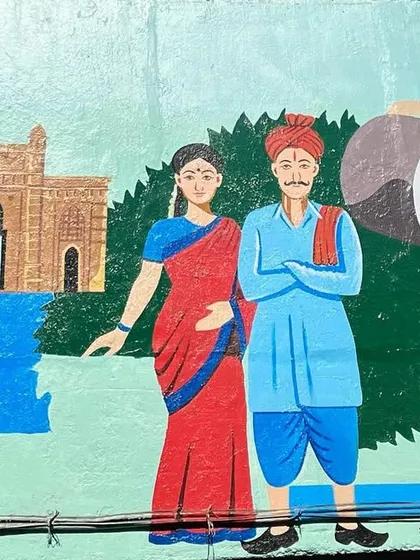 A wall art piece in Dadar depicting the Koli community with the Gateway of India, celebrating the local culture and landmarks.