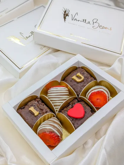 Our Valentine's Day gift box, featuring fudgy brownies and chocolate-coated strawberries, spelling out "I ❤️ U" for a sweet, edible message.
