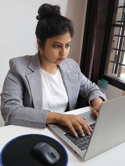 I've always been an organized person, and it's a habit that has served my business well. This is me at my desk, a space where I keep everything organized digitally to ensure my clients get the best of me.