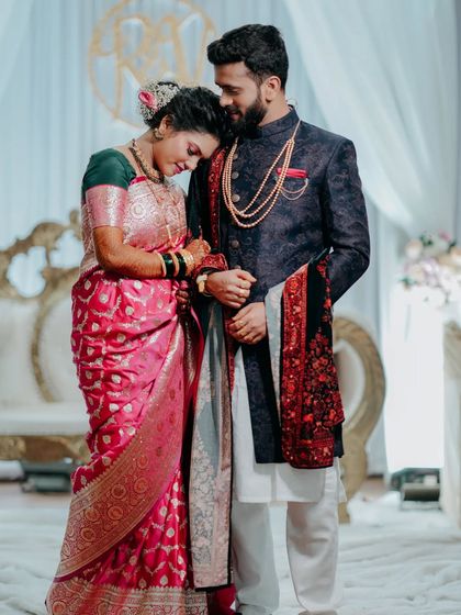 A quiet moment of 'sukoon' amidst the reception celebration. The bride rests her head on the groom's shoulder, a simple gesture full of love.