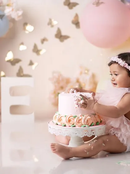 A side view of this little princess enjoying her butterfly cake. The pastel colors are so soft and pretty.