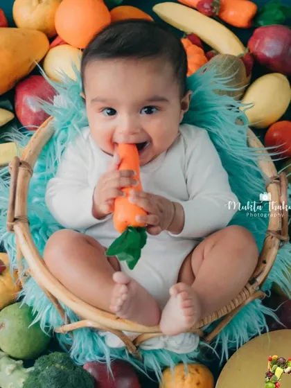 That happy face says it all. This 5-month-old loved his healthy and colorful photoshoot.