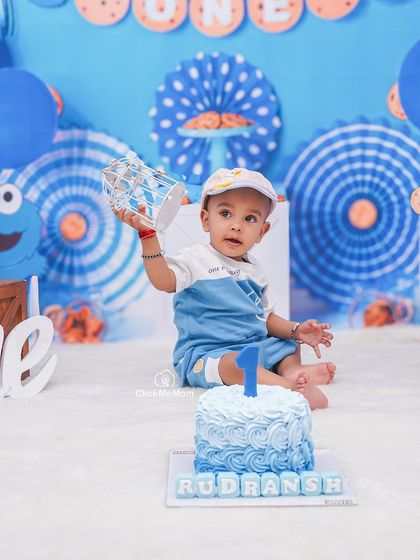 A Cookie Monster theme for this little guy's first birthday. I love creating personalized setups, complete with a custom cake and matching blue decor.