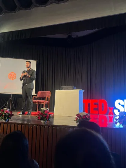 On the TEDx stage, explaining the psychology behind one of my mentalism routines. My talk focused on perception, influence, and the magic of the human mind.
