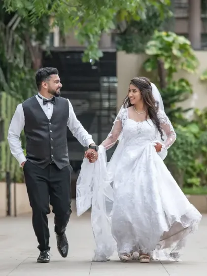 A fun, candid shot of the couple running and laughing together. This captures their playful side and the happiness of the day.