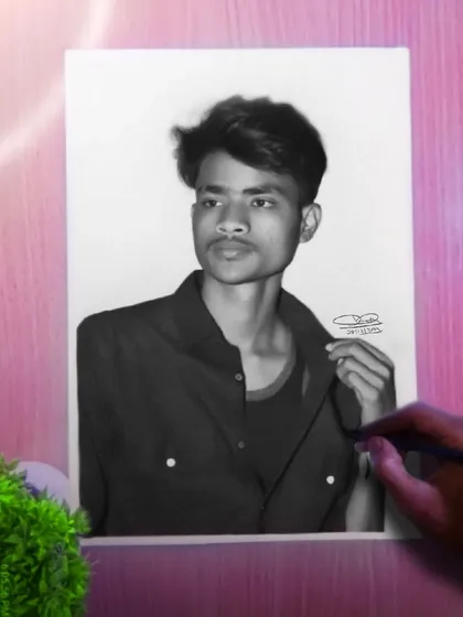 A finished portrait of a young man, with my hand and pencil adding a creative touch.