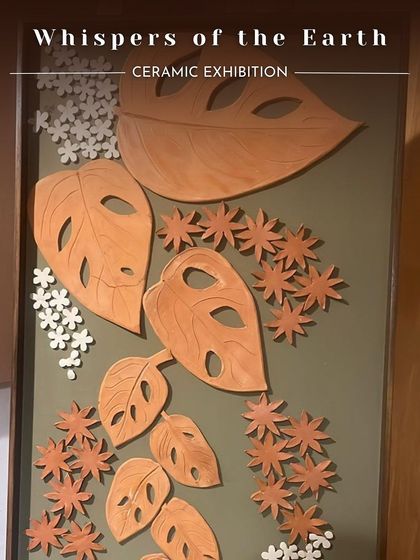A large-scale ceramic wall art piece inspired by monstera leaves and flowers. This was created by the artist Namrata for our 'Whispers of the Earth' exhibition.