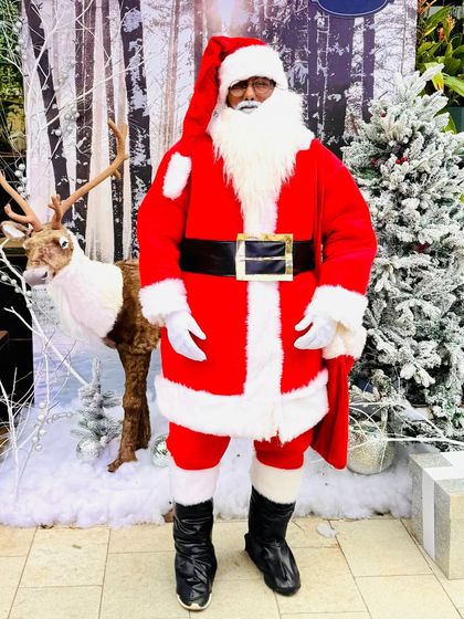 Our premium Santa Claus costume is perfect for creating an authentic and magical North Pole experience. He's ready to listen to wishes and pose for photos at your Christmas event.