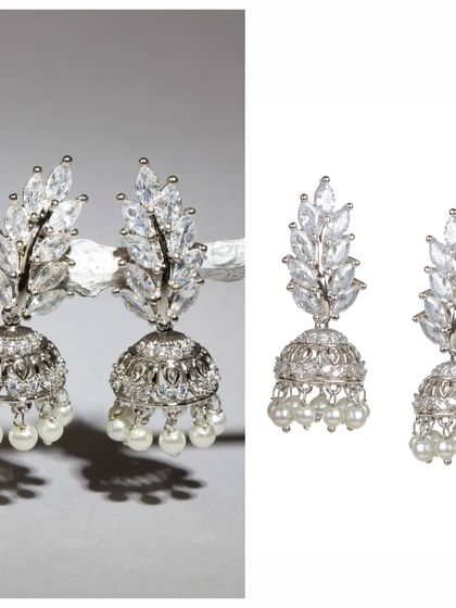 Can you believe these are just 6 grams? These silver-toned jhumkas are embedded with sparkling stones and finished with pearls, offering a touch of glamour in a very lightweight design.