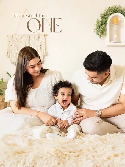 Tell the world, I am ONE! A proud family celebrating their son's first birthday with a beautiful, minimalist studio session.
