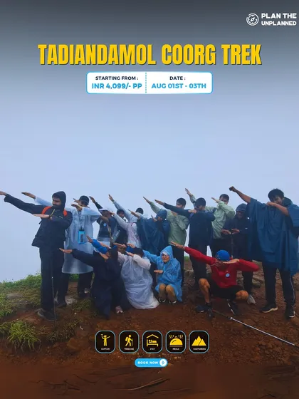 A group strikes a fun pose on the Tadiandamol Coorg trek, showing the fun and camaraderie of our trips.