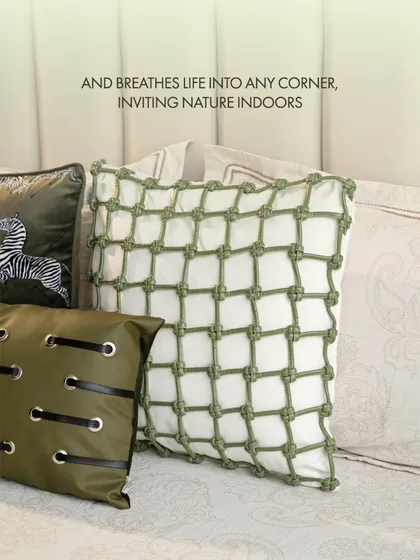 This unique knotted net cushion cover in green and white breathes life into any corner, inviting a sense of nature indoors with its distinct texture and fresh design.