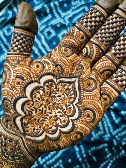 A close-up of an intricate mandala, showing the fine details and use of negative space.