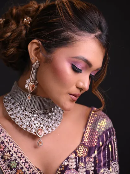 The side profile highlights the texture and volume in the updo, a key focus in my hairstyling classes.