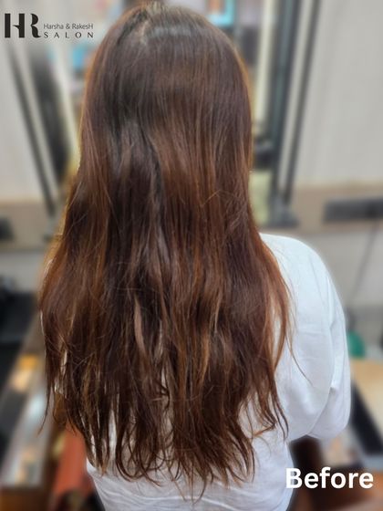 The starting point for the burgundy transformation. Her hair was ready for a refresh, and we achieved a vibrant new look.