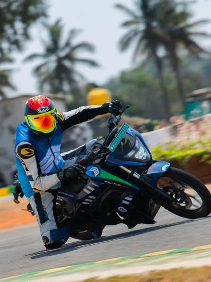 We're also pushing the boundaries of electric motorsports. Here I am coaching on the track, demonstrating how to get the most out of these silent but incredibly powerful EV race bikes.