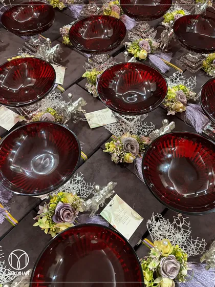 This image displays the contents of the purple velvet box, revealing a stunning ruby-red glass bowl. The contrast between the deep purple, the rich red, and the silver accents creates a truly regal and luxurious gift.