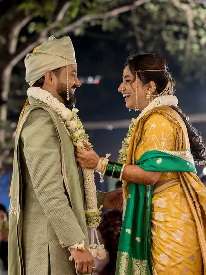 A playful moment during the varmala ceremony.
