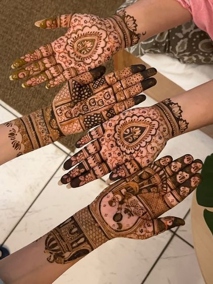Another angle of the bride tribe's henna, showing the beautiful details and patterns on each hand.