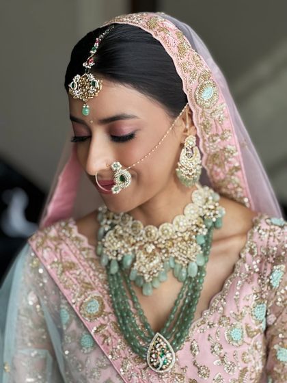 A close-up on the eye makeup, showing the soft blend of pinks and a defined lash line. It's a look that is romantic and captivating.